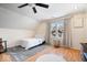Inviting bedroom featuring a comfortable bed, natural light, and light hardwood flooring at 2349 N Delaware St, Indianapolis, IN 46205