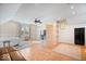 Spacious bedroom area featuring hardwood floors, a ceiling fan, and natural light from a window at 2349 N Delaware St, Indianapolis, IN 46205