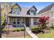 Beautiful home with a cozy porch, manicured shrubs, and a neatly paved walkway at 2349 N Delaware St, Indianapolis, IN 46205