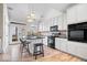 Well-appointed kitchen with white cabinetry, stainless steel appliances, and an island with seating at 2349 N Delaware St, Indianapolis, IN 46205