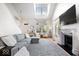 Light-filled living room with vaulted ceiling, statement fireplace, and modern furnishings at 2349 N Delaware St, Indianapolis, IN 46205