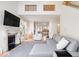 Spacious living room boasts soaring ceilings, fireplace, and abundant natural light at 2349 N Delaware St, Indianapolis, IN 46205