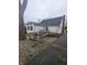 This house features an aging wooden deck and walkway and an exterior in need of maintenance at , Indianapolis, IN 46220