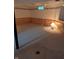 A finished basement area featuring wood paneling, carpeting, and a small window at , Indianapolis, IN 46220