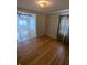 Spacious living room showcases gleaming hardwood floors and an archway entrance to another room at , Indianapolis, IN 46220