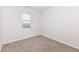 Neutral bedroom featuring a large window and plush carpeting at 286 Lar Lan Dr, Danville, IN 46122