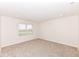 Neutral bedroom featuring a large window and plush carpeting at 286 Lar Lan Dr, Danville, IN 46122