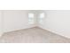 A light-filled bedroom with neutral walls and soft carpet at 286 Lar Lan Dr, Danville, IN 46122