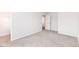 Neutral bedroom with carpet, white walls, closet, and a doorway at 286 Lar Lan Dr, Danville, IN 46122