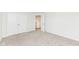 Neutral colored room featuring a double door closet and adjacent doorway at 286 Lar Lan Dr, Danville, IN 46122