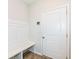 Hallway features a bench and storage unit adjacent to a white door at 286 Lar Lan Dr, Danville, IN 46122