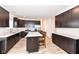 Spacious kitchen boasts stainless steel appliances, dark cabinets, and a large center island with seating at 286 Lar Lan Dr, Danville, IN 46122