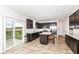 Modern kitchen featuring dark cabinets, stainless steel appliances, and an island at 286 Lar Lan Dr, Danville, IN 46122