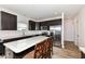 Stylish kitchen featuring a center island, stainless steel appliances and dark cabinetry at 286 Lar Lan Dr, Danville, IN 46122
