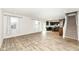 Expansive living space with wood-look floors seamlessly connects to the kitchen and staircase at 286 Lar Lan Dr, Danville, IN 46122