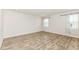 Bright living room with wood-look floors and natural light with window treatments at 286 Lar Lan Dr, Danville, IN 46122