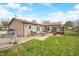 Spacious backyard with brick patio perfect for outdoor entertaining, surrounded by green grass at 301 Lancelot Dr, Franklin, IN 46131