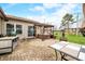 Backyard patio offers a hot tub, a grill, and an outdoor dining area for entertainment at 301 Lancelot Dr, Franklin, IN 46131