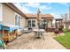 A well-appointed backyard patio featuring an outdoor kitchen, dining, and fire pit area at 301 Lancelot Dr, Franklin, IN 46131