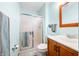 Well-lit bathroom featuring a tiled shower with glass doors and a modern vanity at 301 Lancelot Dr, Franklin, IN 46131