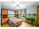 Cozy bedroom with unique built-in storage, ceiling fan and a bright window at 301 Lancelot Dr, Franklin, IN 46131