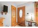 Welcoming entryway features a front door with decorative glass and hardwood floors at 301 Lancelot Dr, Franklin, IN 46131