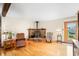 Cozy Gathering room with a wood-burning stove and stone surround at 301 Lancelot Dr, Franklin, IN 46131