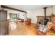 Open living area with hardwood floors, a fireplace and a large window at 301 Lancelot Dr, Franklin, IN 46131
