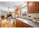 Well-lit kitchen with wood cabinets, stainless steel appliances and an open view to the dining area at 301 Lancelot Dr, Franklin, IN 46131