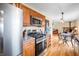 Bright kitchen with stainless steel appliances and a view into the Gathering room at 301 Lancelot Dr, Franklin, IN 46131