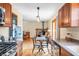 Bright kitchen with stainless steel appliances, wood cabinets and an open layout leading to the living area at 301 Lancelot Dr, Franklin, IN 46131