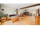 Spacious living room with hardwood floors, a fireplace, and natural light at 301 Lancelot Dr, Franklin, IN 46131