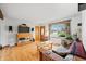 Spacious living room with hardwood floors and a large window at 301 Lancelot Dr, Franklin, IN 46131