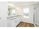 Bathroom boasts double sinks, granite countertops, wood flooring, and a glass-enclosed shower at 3241 Fawn Cir, Brownsburg, IN 46112
