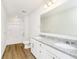 Bathroom featuring double vanity, granite countertop, and wood look flooring at 3241 Fawn Cir, Brownsburg, IN 46112