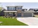 Beautiful two-story home featuring a lawn, grey siding, stone accents and an attached two car garage at 3241 Fawn Cir, Brownsburg, IN 46112