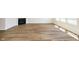 Spacious living room featuring hardwood-look floors, recessed lights, a fireplace and lots of natural light at 3241 Fawn Cir, Brownsburg, IN 46112