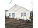 A spacious wooden back deck with outdoor seating offers a relaxing spot to enjoy the outdoors at 3259 Eddy Ct, Indianapolis, IN 46214