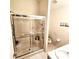 Bright bathroom with a glass-enclosed shower, vanity, and a tiled wall at 3259 Eddy Ct, Indianapolis, IN 46214