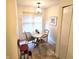 A small dining area features a tile table, 4 chairs, and a window overlooking the back yard at 3259 Eddy Ct, Indianapolis, IN 46214
