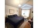 A cozy main bedroom featuring a comfortable bed, soft lighting, and a serene ambiance at 3259 Eddy Ct, Indianapolis, IN 46214