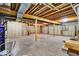 Large unfinished basement featuring exposed ceiling beams and concrete walls, perfect for storage or future renovation at 328 Millridge Dr, Indianapolis, IN 46290