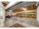 Unfinished basement with exposed ceiling and shelving at 328 Millridge Dr, Indianapolis, IN 46290