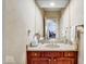 Bathroom with vanity and mirror and view to a bedroom through the doorway at 328 Millridge Dr, Indianapolis, IN 46290