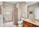 Neutral bathroom featuring a tub and shower combination with a wood vanity at 328 Millridge Dr, Indianapolis, IN 46290