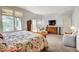 Spacious bedroom with a large windows and a decorative bed at 328 Millridge Dr, Indianapolis, IN 46290