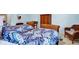 Bedroom features light blue walls and matching bench and wood wardrobe at 328 Millridge Dr, Indianapolis, IN 46290