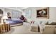 Bright bedroom with shuttered windows, sitting area, and neutral carpeting at 328 Millridge Dr, Indianapolis, IN 46290