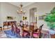 Formal dining room with hardwood table, chandelier, and a decorative rug at 328 Millridge Dr, Indianapolis, IN 46290