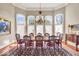 Elegant dining room with hardwood floors, a chandelier, and a large windows at 328 Millridge Dr, Indianapolis, IN 46290